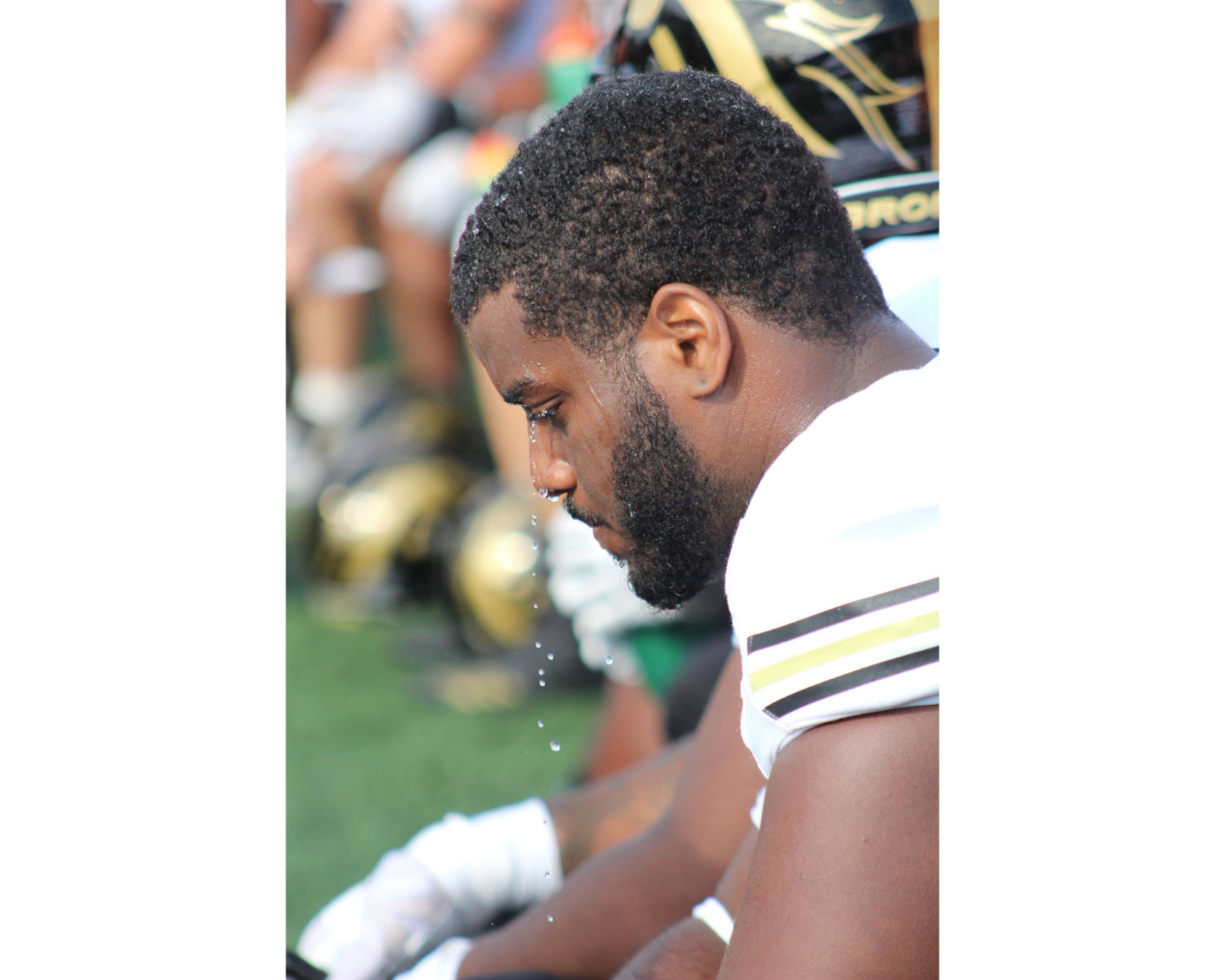 Kaillen Guilleroy rests on the sidelines at the Glass bowl